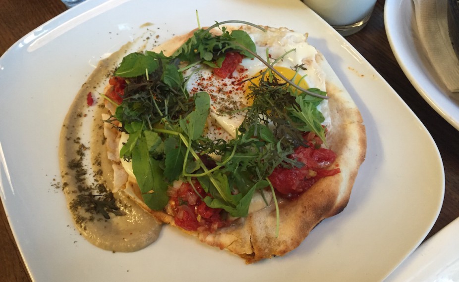 Harissa Pain Plat 2 fried eggs, beef ‘burger', grilled pita, Parmesan, tomato salsa, spiced hummus, baba ganoush & seasonal greens.