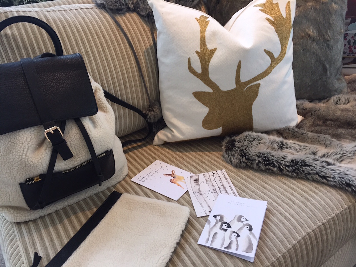 Indigo Holiday 2015: Faux Shearling Backpack ($69.50) / 18 x 18 Gold Deer Pillow Cover ($39.50)