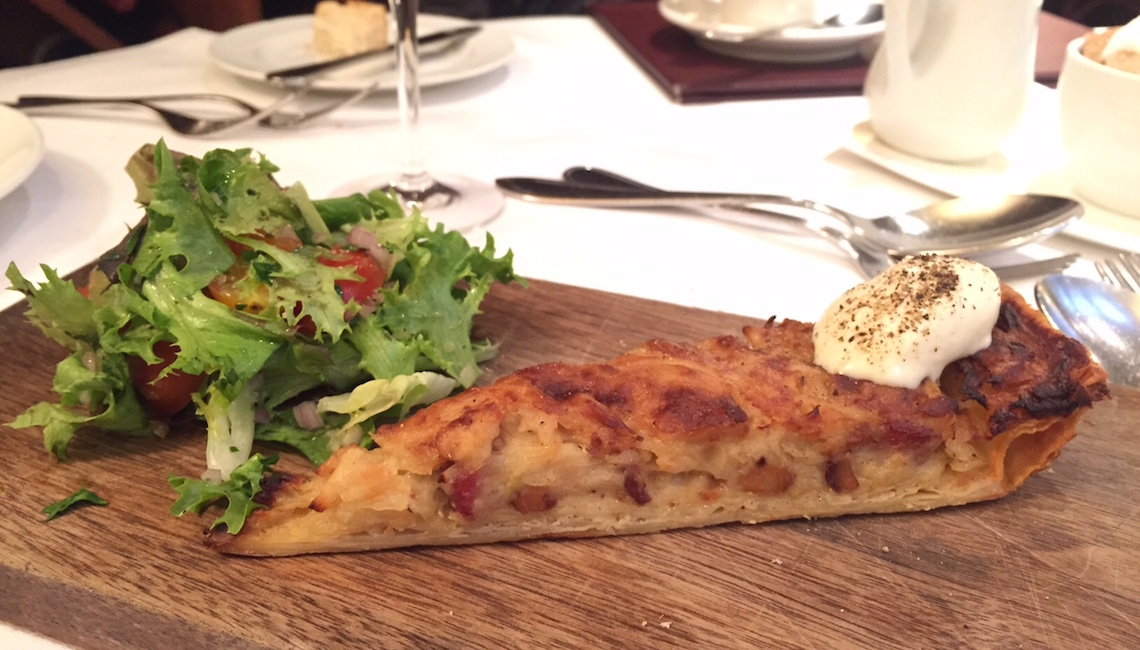 Onion Tart ($13) - Bacon, Gruyere, Mixed Greens