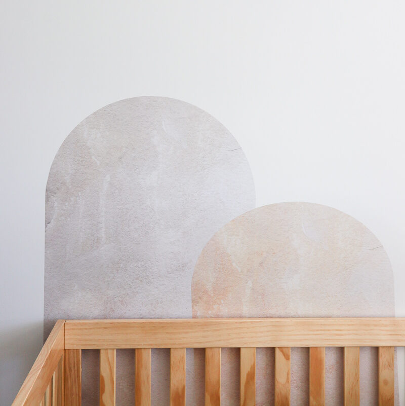 Urban Walls "Shapes & Sizes Wall Decals behind nursery crib